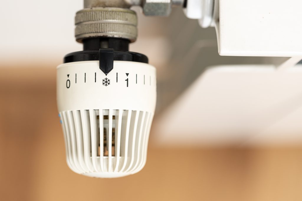 close up of heating radiator thermostat showing co 2025 02 21 00 48 51 utc